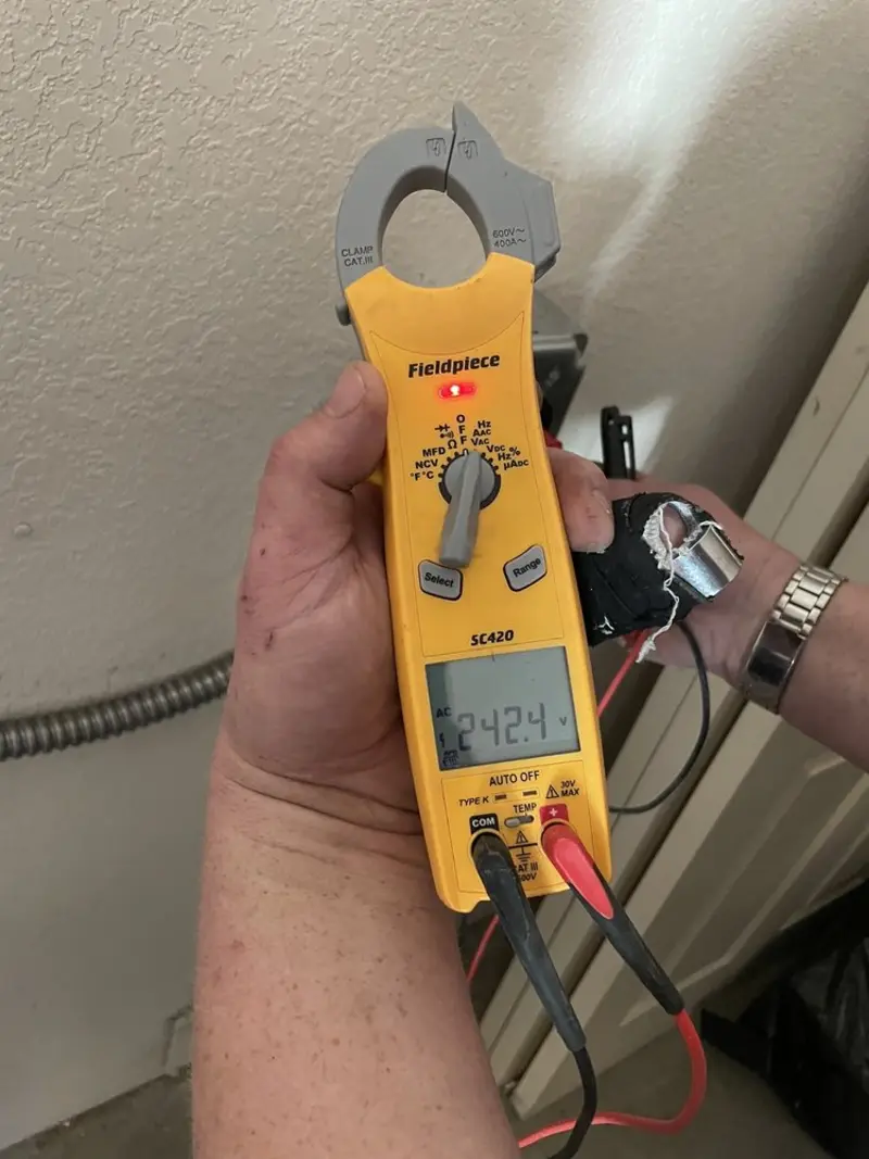 Voltage testing with clamp meter during Ceiling Fan Installation in Paxton